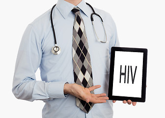 Image showing Doctor holding tablet - HIV