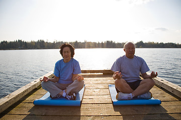 Image showing Senior asian couple exercising