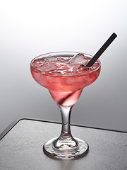 Image showing glass of pink iced cocktail