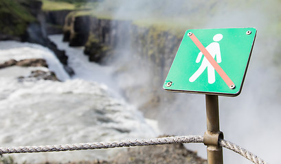 Image showing Forbidden to walk over here - Iceland - Fierce waterfall in back