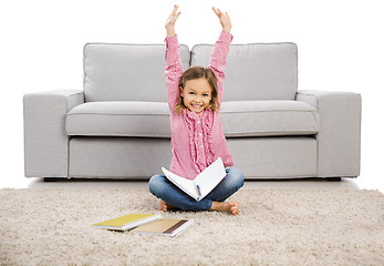 Image showing Little girl making homework