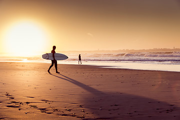 Image showing Surfers on the beach