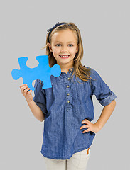 Image showing Girl holding a puzzle