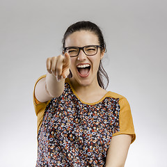 Image showing Happy woman pointing