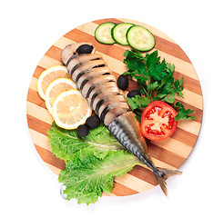 Image showing sliced herring on wooden plate