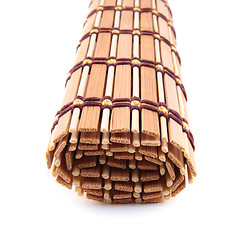 Image showing folded bedding wooden tea isolated