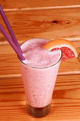 Image showing milkshake on wooden background