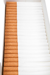 Image showing various cigarettes closeup on a white