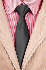 Image showing Close-up of red striped shirt with black tie