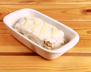 Image showing white lasagna isolated on wooden background