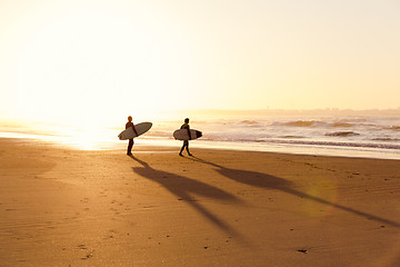 Image showing Surfers on the beach