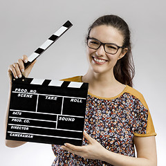 Image showing Woman with a clapboard