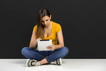 Image showing Woman working with a tablet