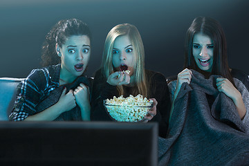 Image showing Scared teenage watching movies 