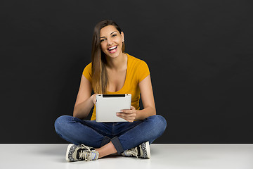 Image showing Woman working with a tablet