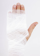 Image showing bandaged hand on white background