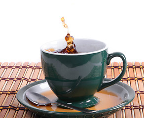 Image showing cup of green tea with splash