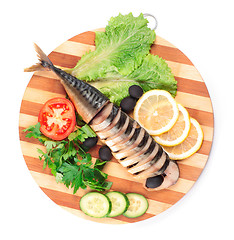 Image showing sliced herring on wooden plate