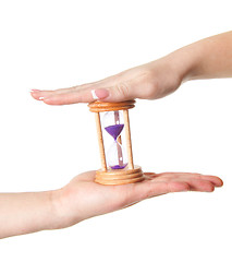 Image showing man and woman hands holding Hour Glass