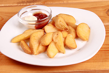 Image showing coocked potatot with ketchup isolated