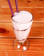 Image showing milkshake on wooden background