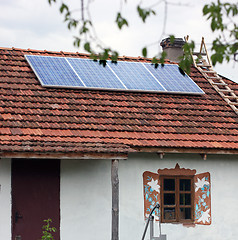 Image showing Old antique house with solar panels