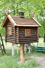 Image showing Toy house in the woods . A hut on chicken legs