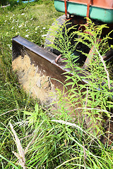 Image showing Bulldozer, destroying the plants growing on soil