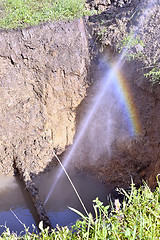 Image showing The water jet in the form of leakage in the damaged metal pipe at the production site