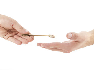 Image showing Male hand holding golden key