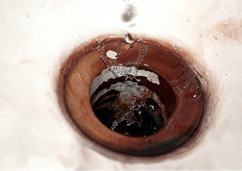 Image showing Waterdrops falling into vintage sink