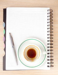 Image showing blank page, empty cup of coffe, pen