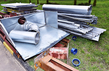 Image showing Metal parts are dismantled structures stored in the soil on the territory of industrial site