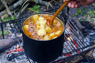 Image showing The cooking of soup on the fire