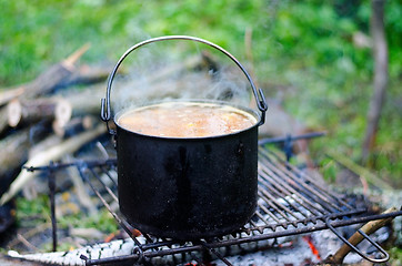 Image showing The cooking of soup on the fire