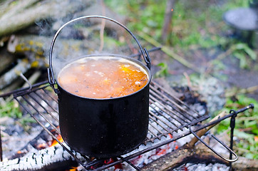 Image showing The cooking of soup on the fire