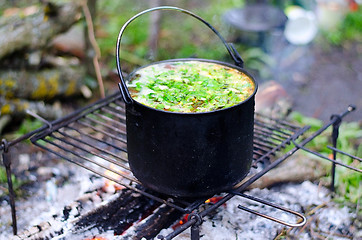 Image showing The cooking of soup on the fire