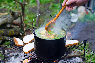 Image showing The cooking of soup on the fire