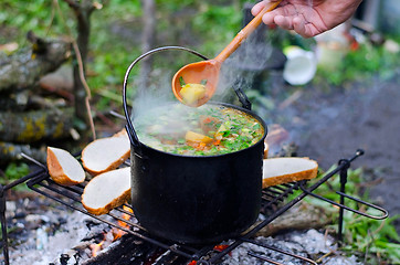 Image showing The cooking of soup on the fire