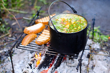 Image showing The cooking of soup on the fire