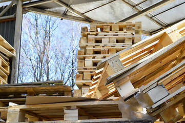 Image showing Waste wood from pallets stacked in the storage room