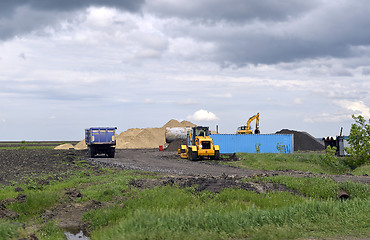 Image showing  Yellow excavator working digging in sand quarry