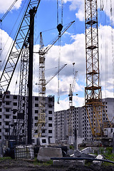 Image showing  Construction site with cranes on sky background