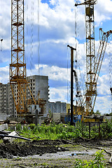 Image showing  Construction site with cranes on sky background