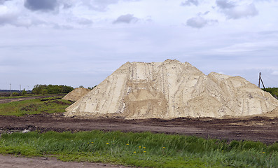 Image showing  Yellow excavator working digging in sand quarry