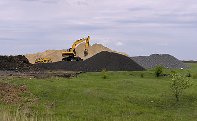 Image showing  Yellow excavator working digging in sand quarry