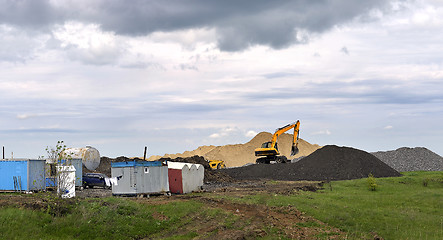 Image showing  Yellow excavator working digging in sand quarry