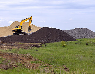 Image showing  Yellow excavator working digging in sand quarry