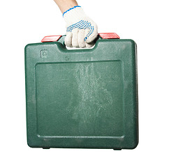 Image showing Green tool box in workers hand