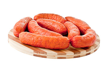 Image showing delicious sausages on board